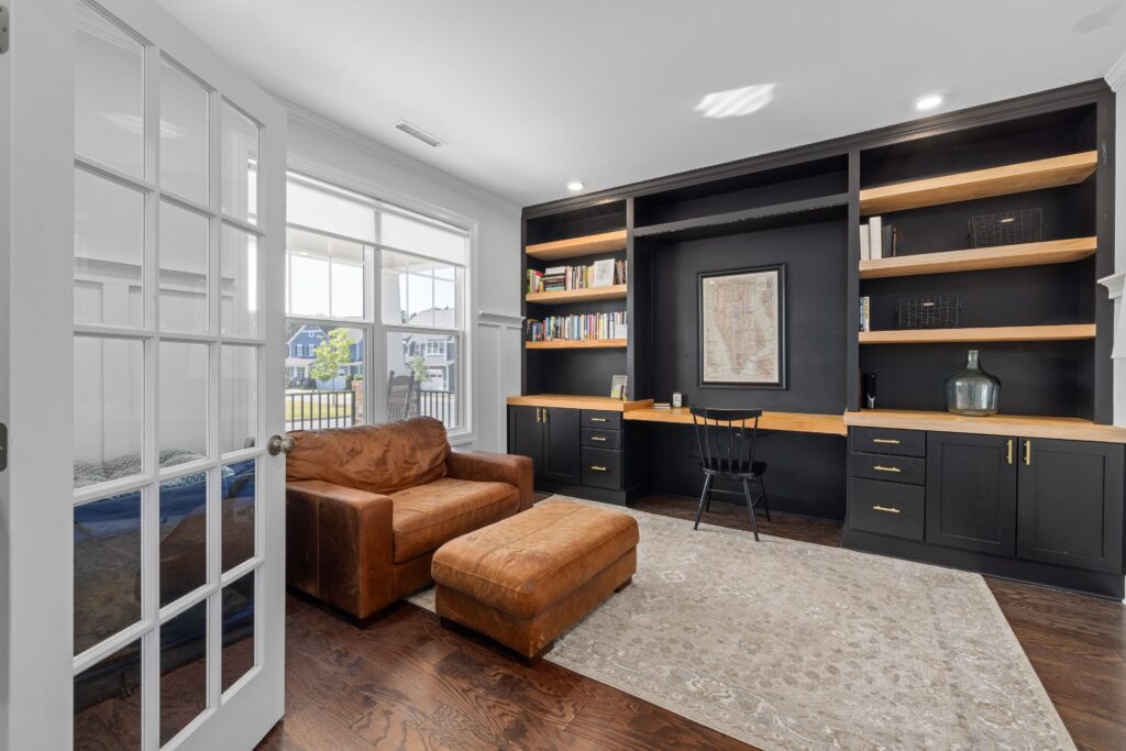 pexels-photo-24245784-24245784 Bright and stylish home office with bookshelves and comfortable seating for a luxury vibe.